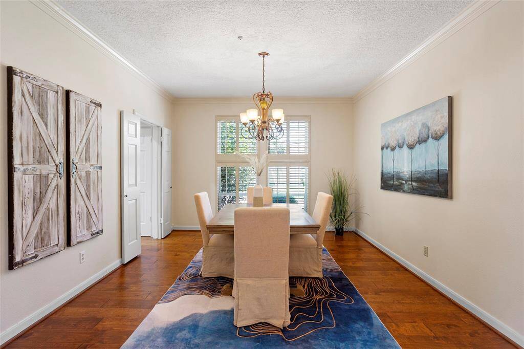 Picture family dinners here in this elegant dining room with gorgeous chandelier and plantation shutters.