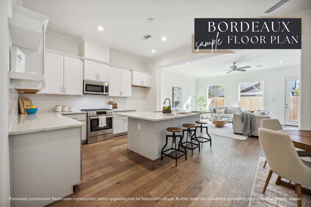 This light-filled layout delivers everything you're looking for —open-concept living, elegant engineered wood floors, tall ceilings, and backyard views, all on the first floor.
