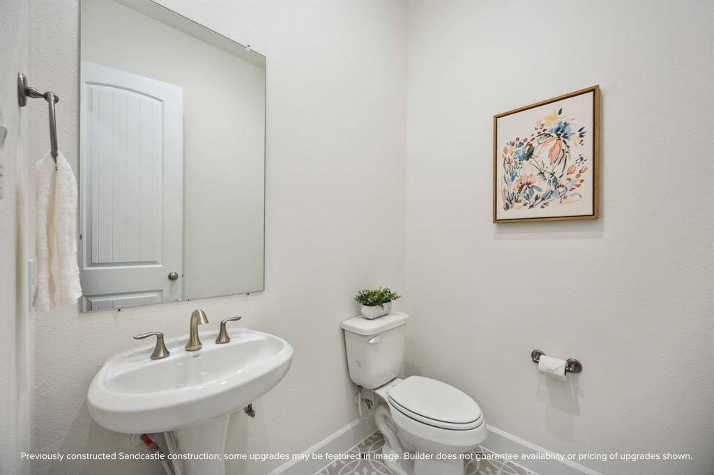 This powder bath may be petite, but it’s polished to perfection. With sleek fixtures and a splash of charm, it’s the kind of space guests will remember.