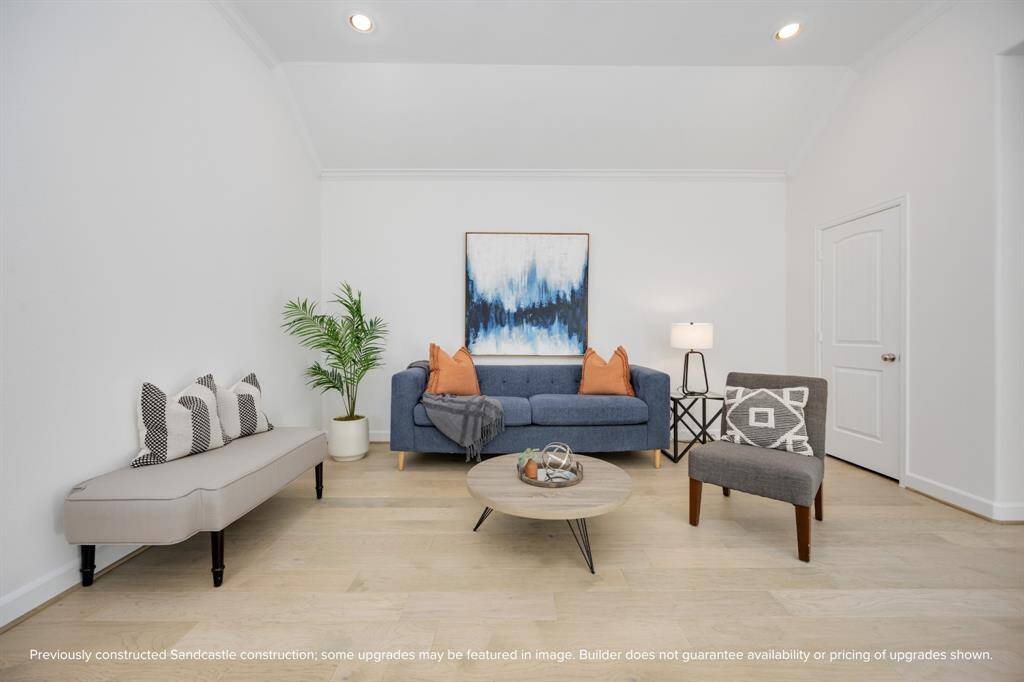Crisp lines, curated color pops, and soft natural light make this upstairs living area feel like a boutique hotel lounge—right in your own home.