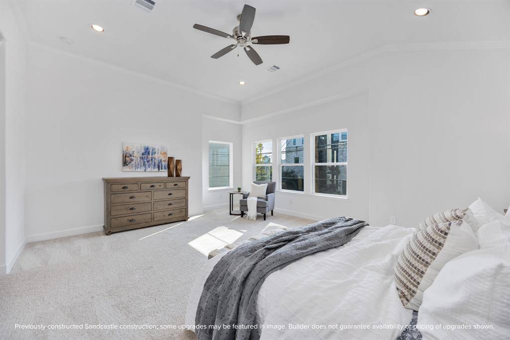 Bask in all-day sunshine thanks to walls of windows in this luminous bedroom. Whether you’re curling up with a book or sipping your first coffee—this space just feels good.