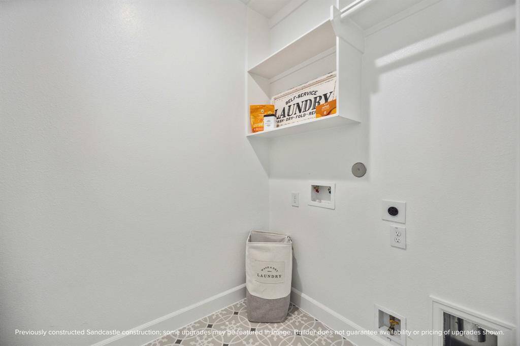 Clean design meets clever function in this dedicated laundry room. With built-in shelving and plenty of space to fold, it actually makes chores feel…doable.
