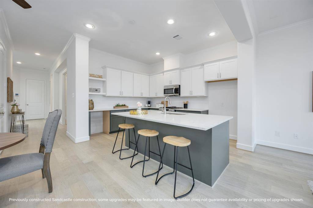Zoom in on the beauty: crisp cabinetry, statement lighting, and luxurious quartz countertops—each detail curated to blend function and flair.