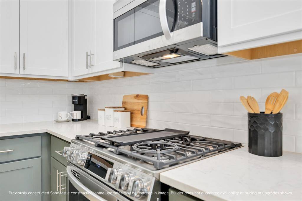 No walls needed here—just gorgeous flooring, smart lighting, and effortless flow between your kitchen workspace, dining table, and living area.