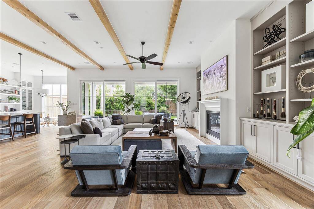 The Formal Family Room Blends Beautifully With The Family Space, Offering A Welcoming Path To The Gourmet Kitchen And Relaxing Outdoor Lanai.