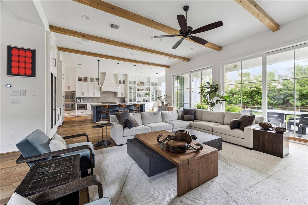 Wood Beams, Cast Gas Fireplace, Wood Flooring, Upgraded Lighting Pendants, On-Site Custom Cabinetry, Recessed Lighting and Whole Home Wired For Entertainment.
