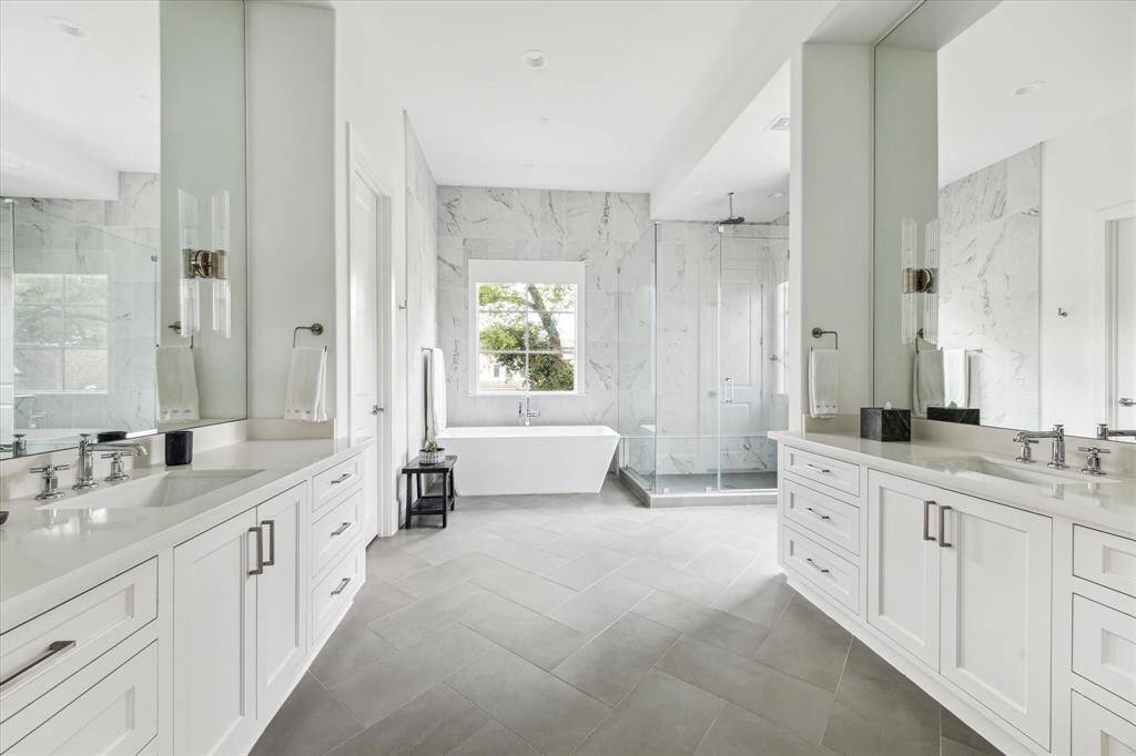 Double Vanities Featuring Marble & Ferguson Lighting Sconces.