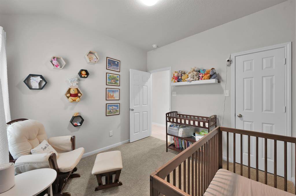This secondary bedroom has ample space with a walk in closet!