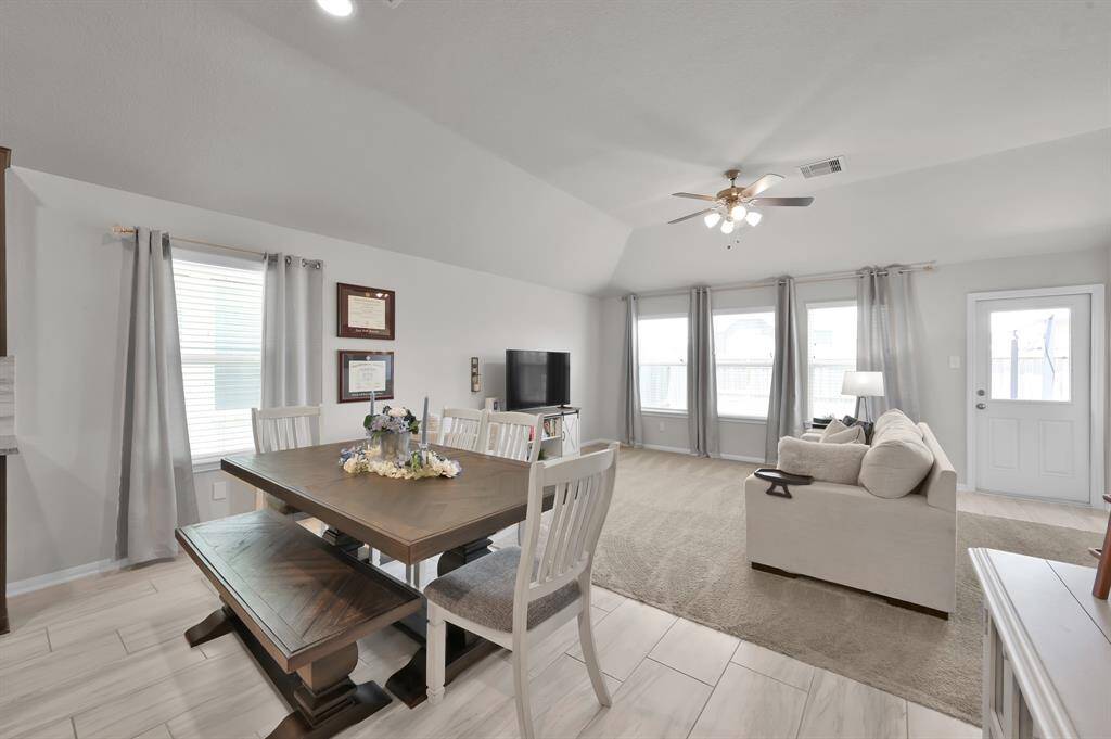 Enjoy a cozy carpeted living space with ample natural light.