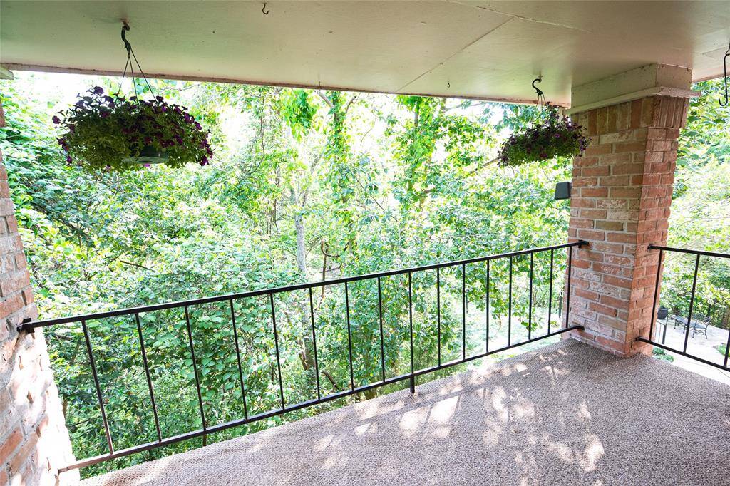 Tranquil balcony with peaceful views and soothing sounds of nature.
