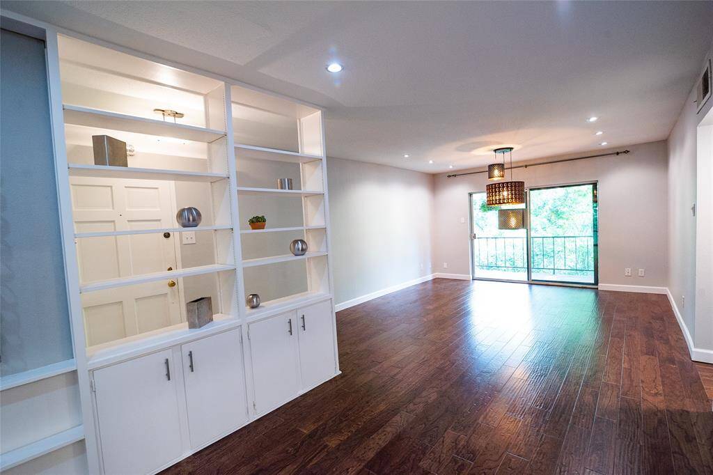 Bright and open living space, hardwood floors, Note: lamp has been replaced.