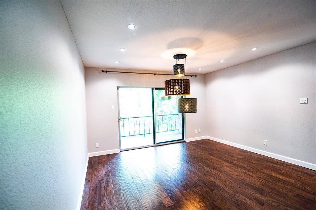 Seamless access to a private balcony.with peaceful treetop views. Note: lamp has been replaced.