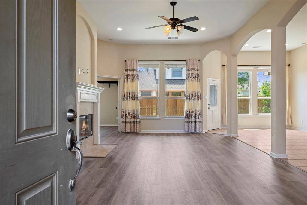 As you enter, you will see the spacious living, dining and kitchen w/ cozy gas fireplace. The home has brand new luxury vinyl flooring throughout the home