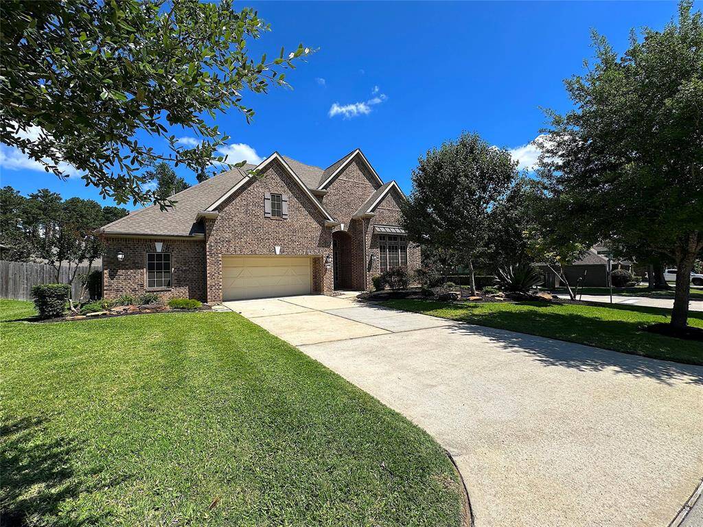 Beautiful 1.5 Story on corner lot with lush landscaping
