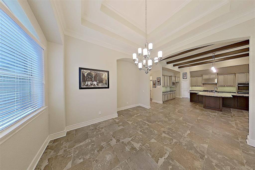 Spacious DR with dual tray ceiling and cut-out for butler's pantry