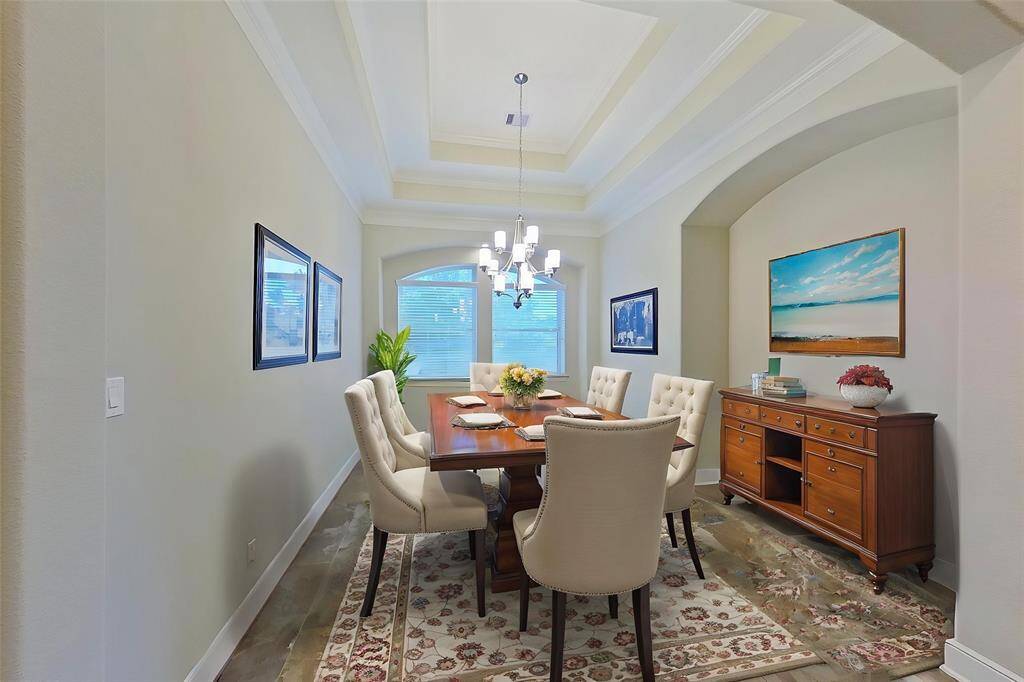 Virtually staged Dining room, larger than appears in photo