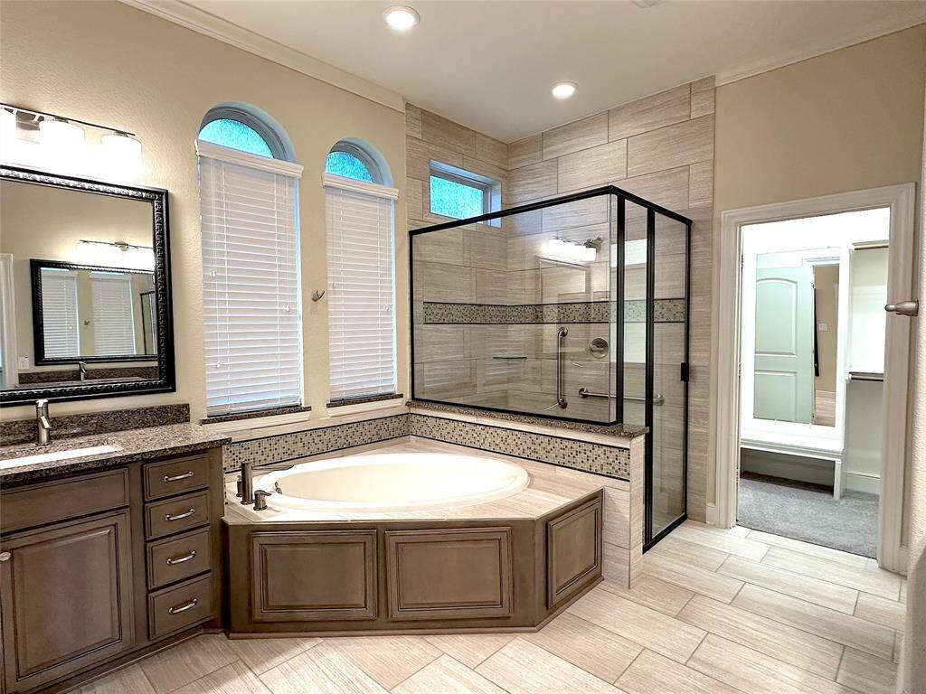 Primary bath with large shower and soaking tub