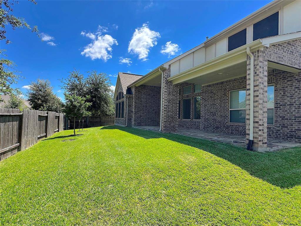 Good sized backyard with large covered porch