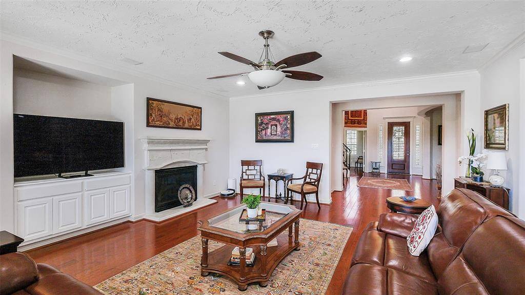 The large family room is the heart of the home with picturesque views of your gorgeous back yard with golf course view, amazing gardens and a pool.