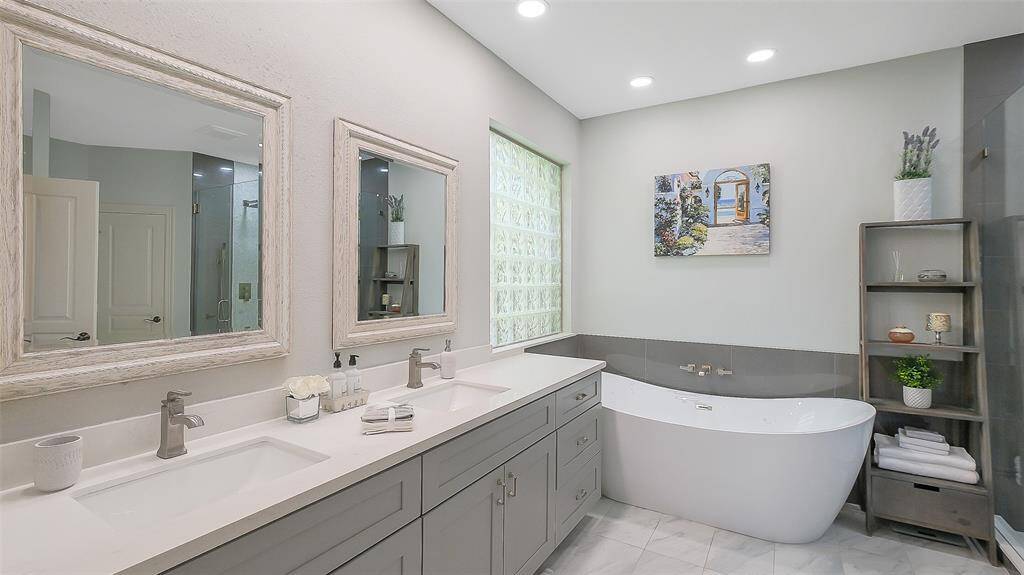 Tiled shower and custom tile shelf for bathing products.  Privacy glass window.
