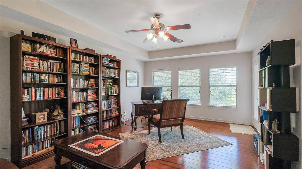 Custom chair rails, crown molding, recessed lighting and French doors.  This room has so many options for use.