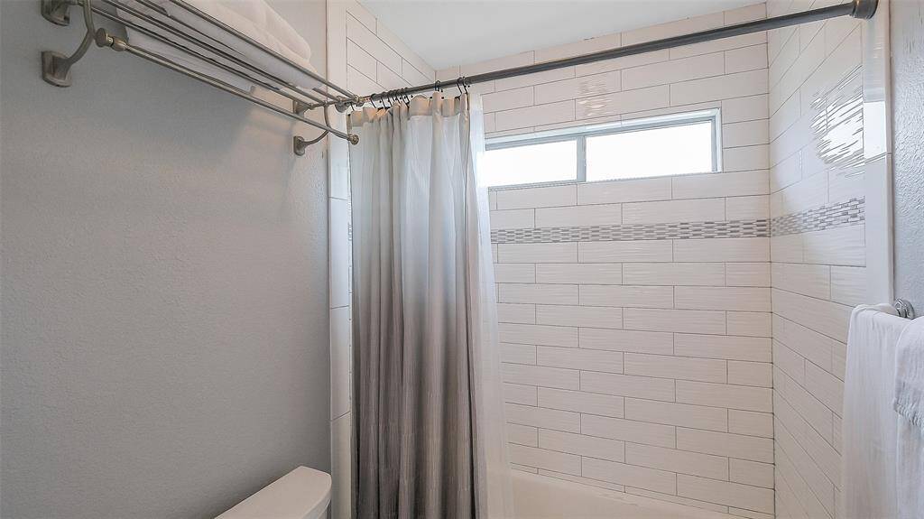 A Hollywood bathroom connects to guest bedroom #2 & #3.  Another fully remodeled bathroom! Double granite counters, undermount sink and upgraded fixtures.