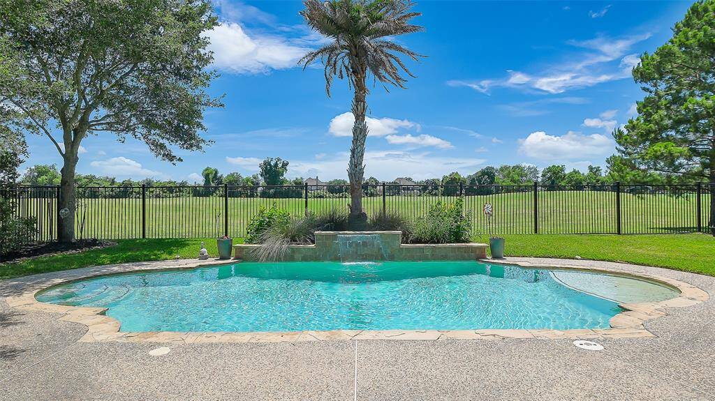 The large covered tiled patio is perfect for relaxing and having guests over.