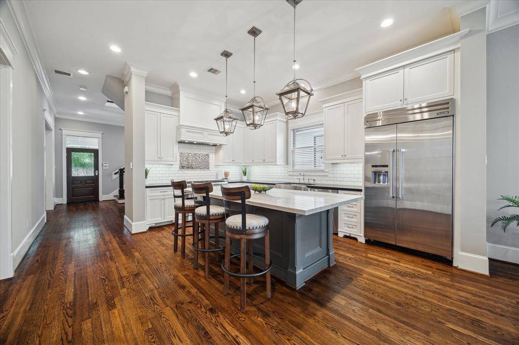 Bar seating around the kitchen island.