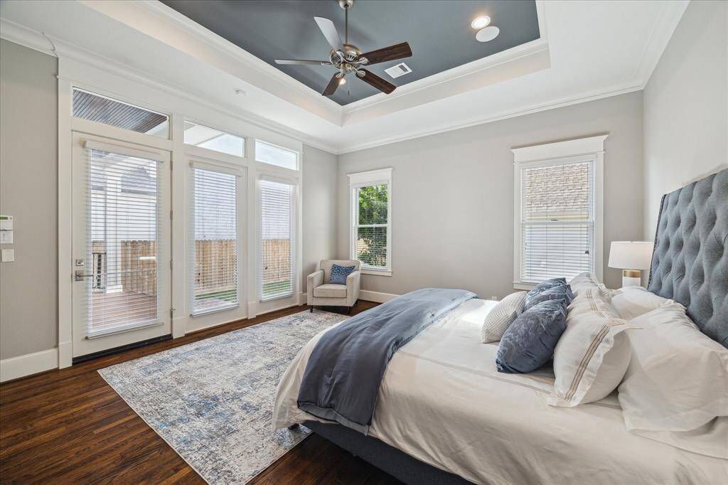 Tray ceiling in primary plus a door that leads you to the backyard.