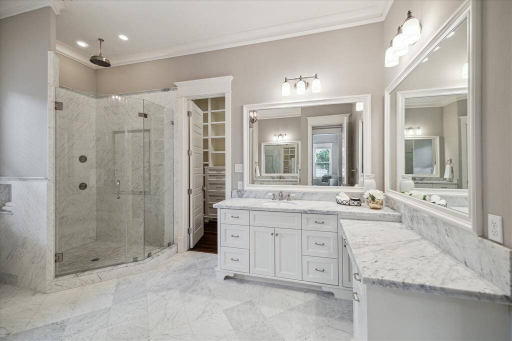 Plenty of space in the primary bathroom to make getting ready a breeze.