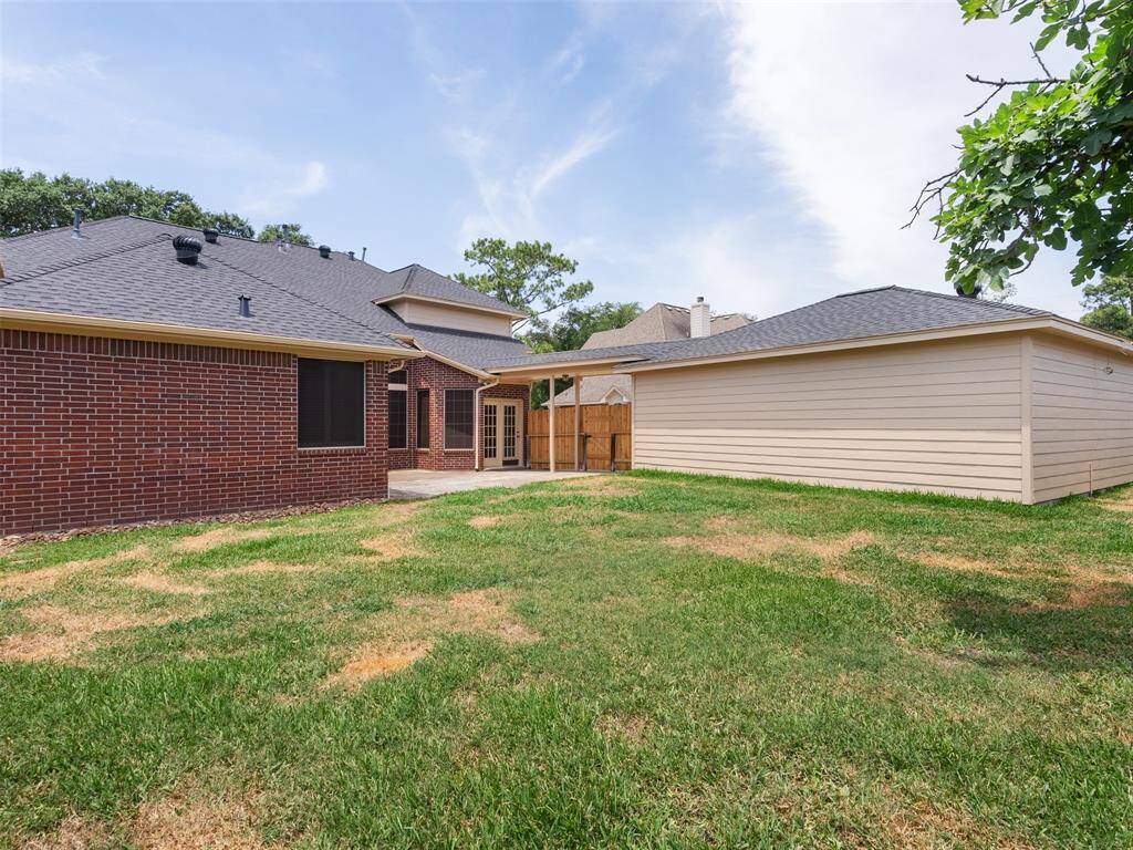 Another view of the back yard with Detached garage with extra storage area.