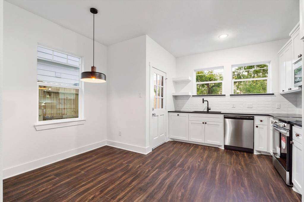Here’s the breakfast nook—can be used for a work space, smaller dining area, or a great space to add a mobile island!