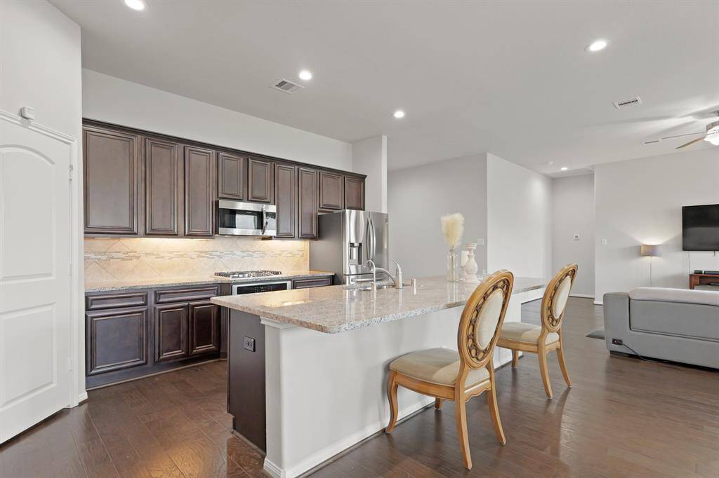 Enjoy casual meals or morning coffee at the islandâ€”this kitchen is as practical as it is stylish.