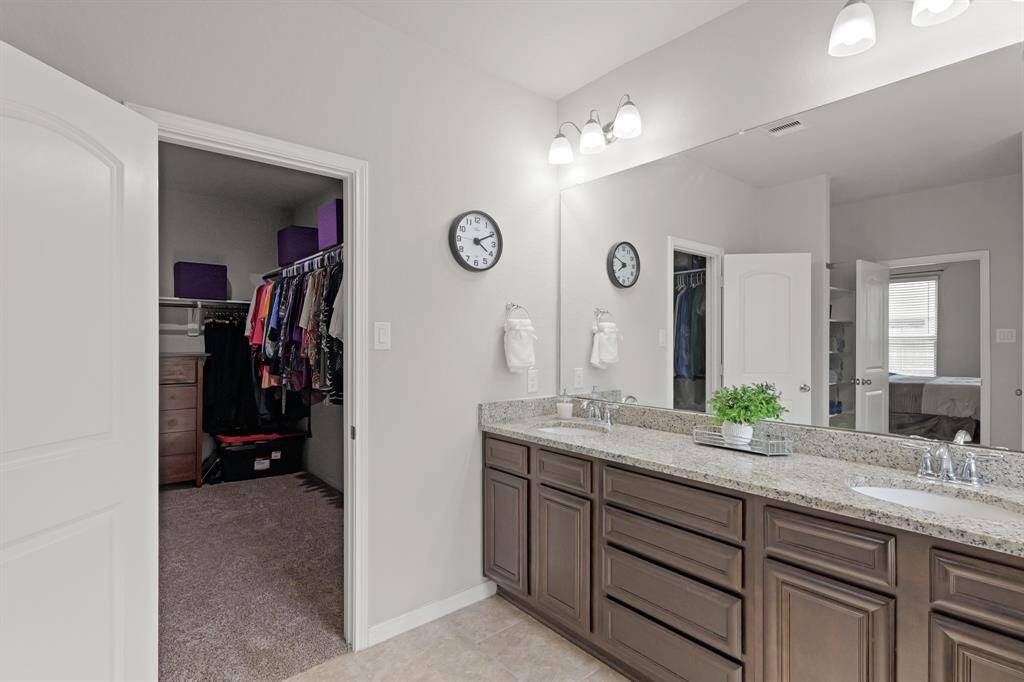 A thoughtful layout connects the primary bath to a generous walk-in closet—everything you need, right where you need it.