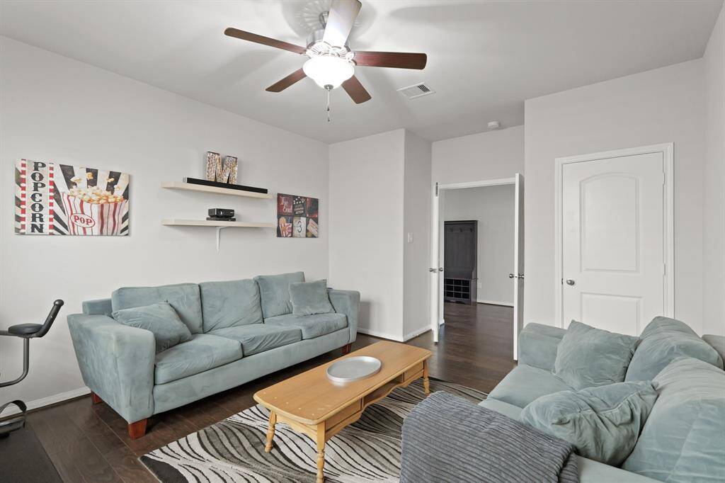 Tucked just off the front hallway, this versatile space features double doors and endless possibilities—office, gym, guest suite, or more.