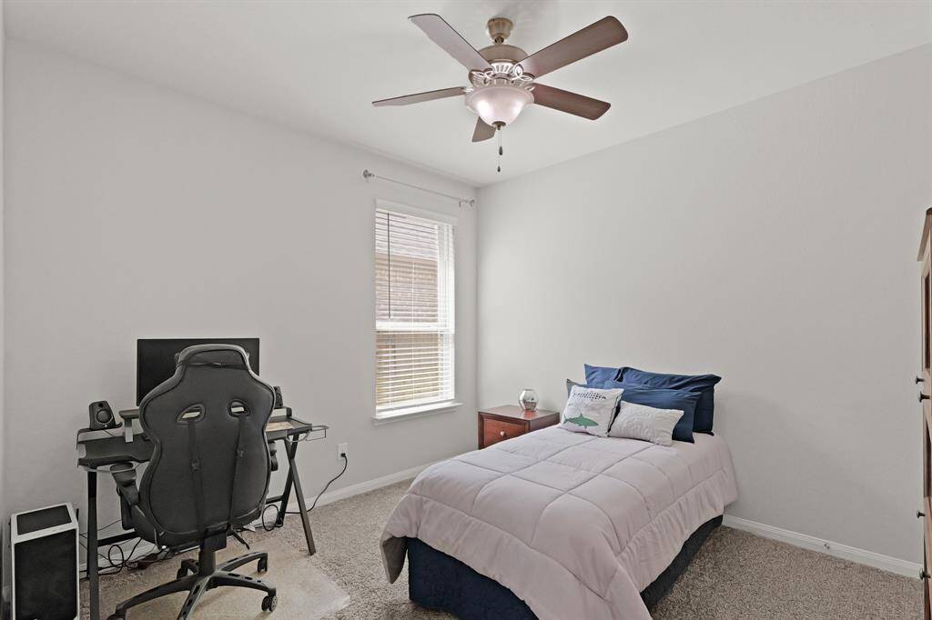 Flexible layout with easy hallway access and a full-size closet—ideal as a guest room or home office.