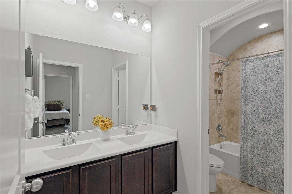 With a separate door between the vanity and shower/toilet area, this bathroom is ideal for busy households—letting multiple people get ready at once without getting in each other’s way.
