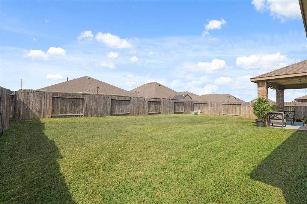Enjoy the open yard with no two-story homes directly behind—just privacy and blue skies.