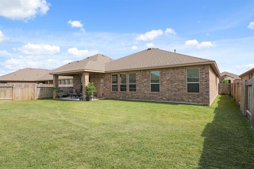 Spacious backyard with plenty of room to run, play, or add your dream garden or pool.