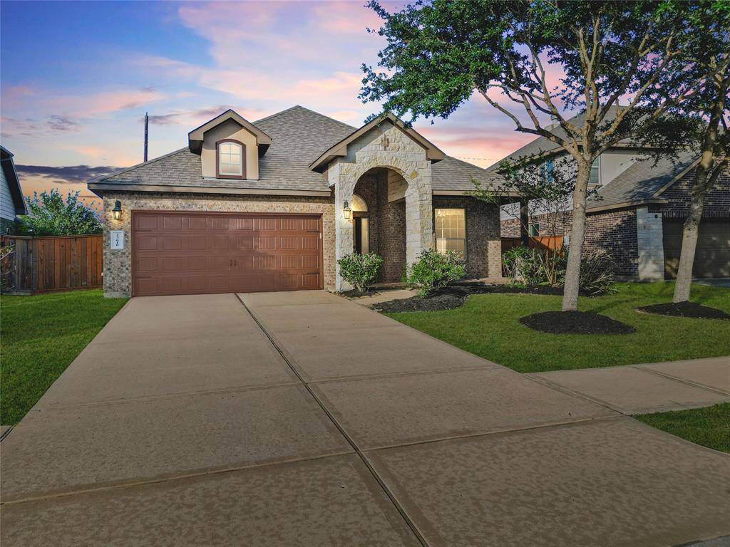 Welcome to 23610 Ortensia Street—featuring a classic brick and stone façade, arched entry, and an extended driveway leading to a 2-car garage. Great curb appeal in a gorgeous and mature neighborhood