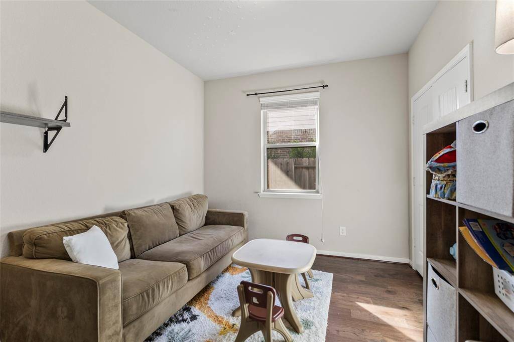 This flex room easily transforms with your day—morning playdates, afternoon quiet time, or a cozy evening lounge. With warm natural light and a practical layout, it's ready for whatever rhythm life brings.