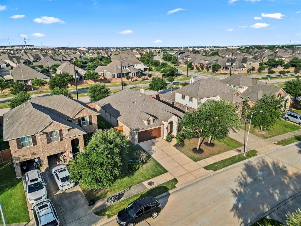 Tucked on a tree-lined street with a wide driveway, classic brick exterior, and great curb appeal.