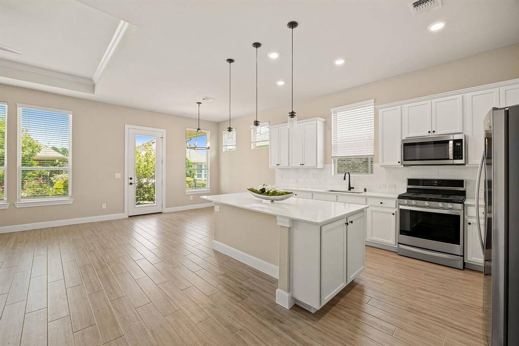 All stainless steel appliances in the kitchen.