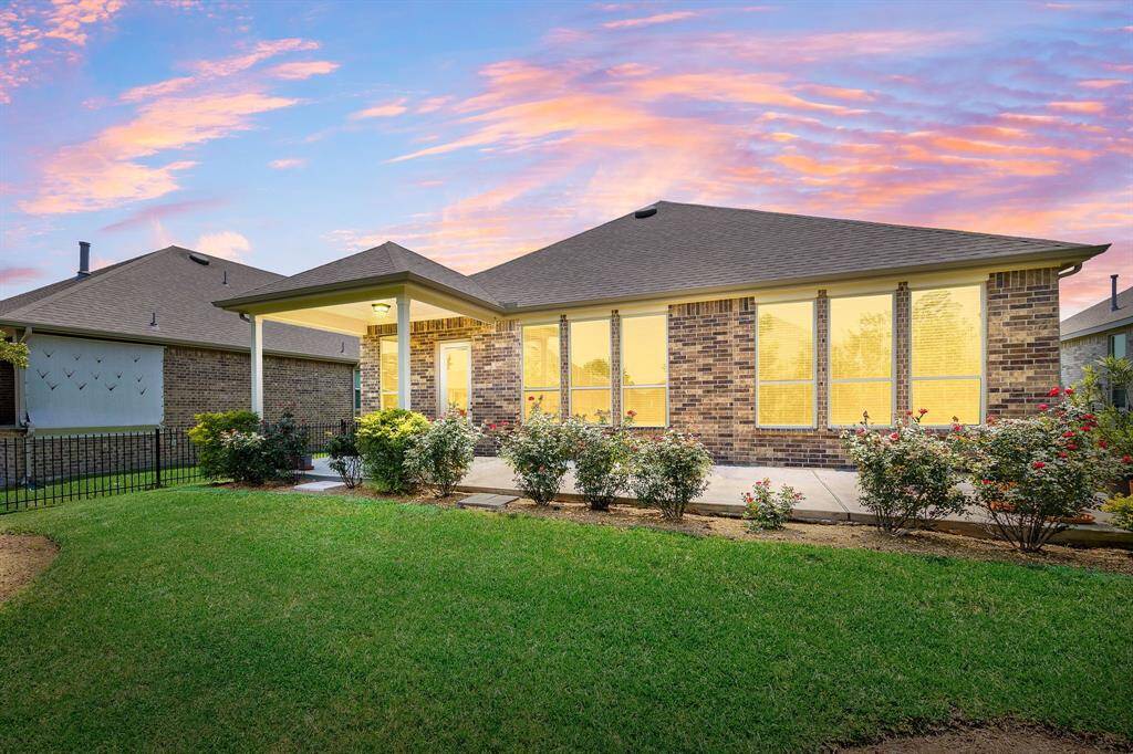 All brick elevation with lots of windows.