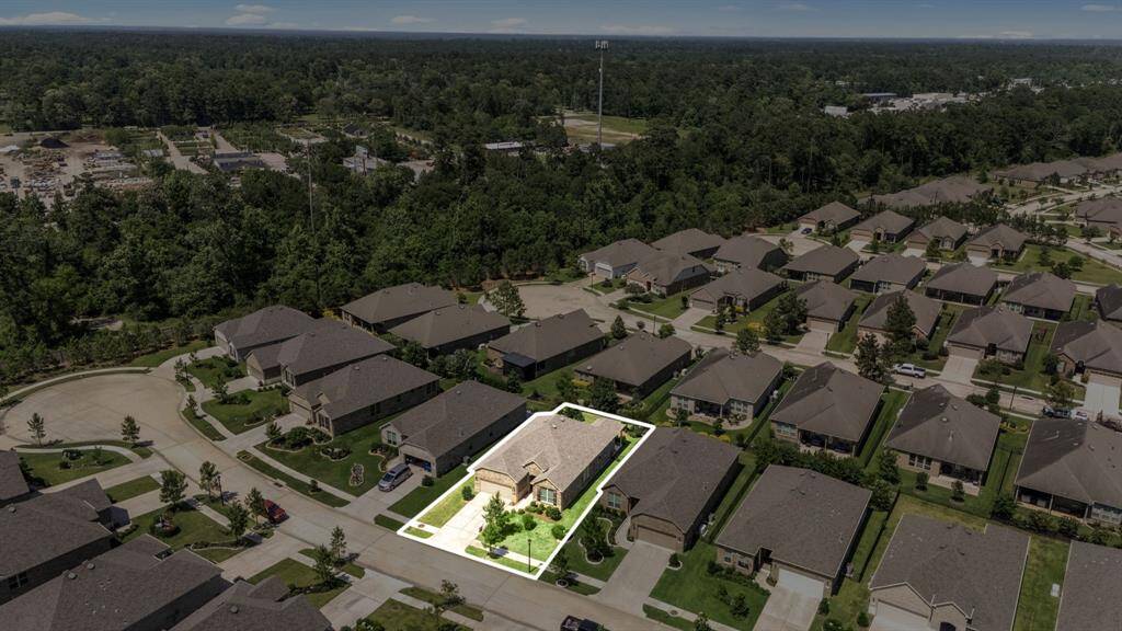 This home is highlighted to showcasing the spacious lot with a neatly maintained landscaping and a double wide driveway. The area offers a mix of tranquility and access to nearby amenities.