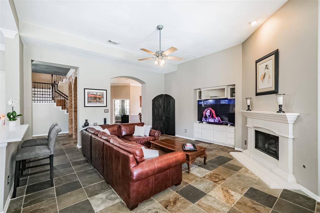 Experience seamless elegance with a view from the spacious living area into the inviting front foyer.