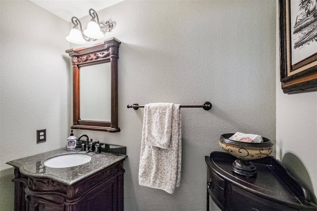 Inviting powder bath off the foyer with fresh paint for a modern touch.