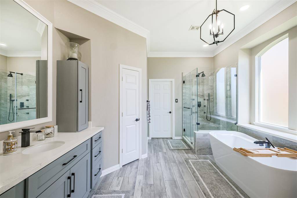 Luxurious and modern primary bath with elegant finishes.