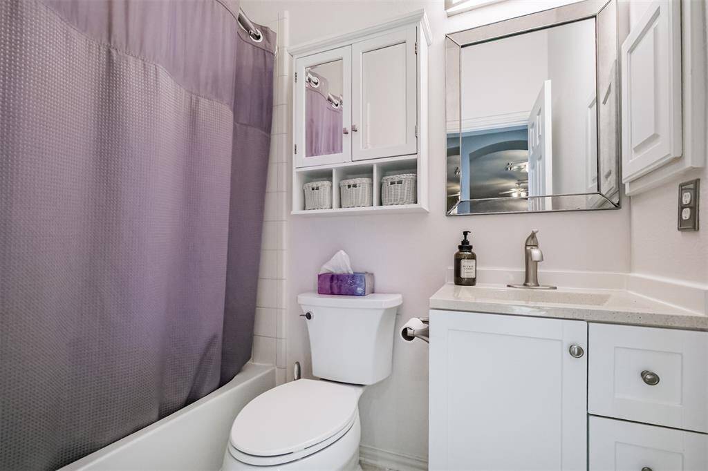 Charming secondary bathroom featuring modern fixtures, ample storage, and a soothing color palette for a relaxing atmosphere.
