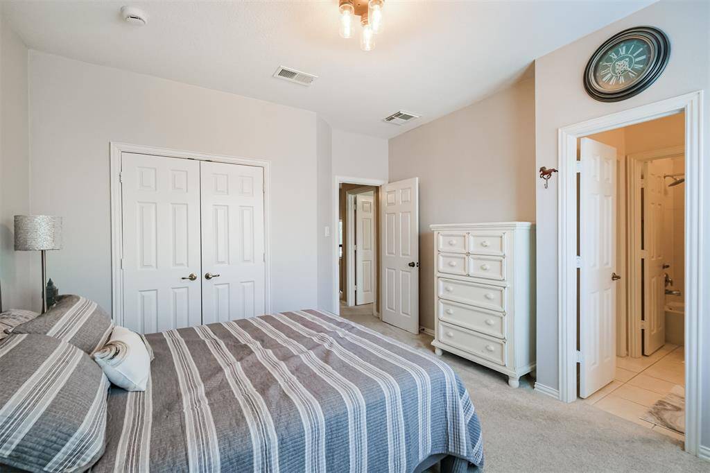 The third upstairs bedroom opens into the second bathroom for convenience